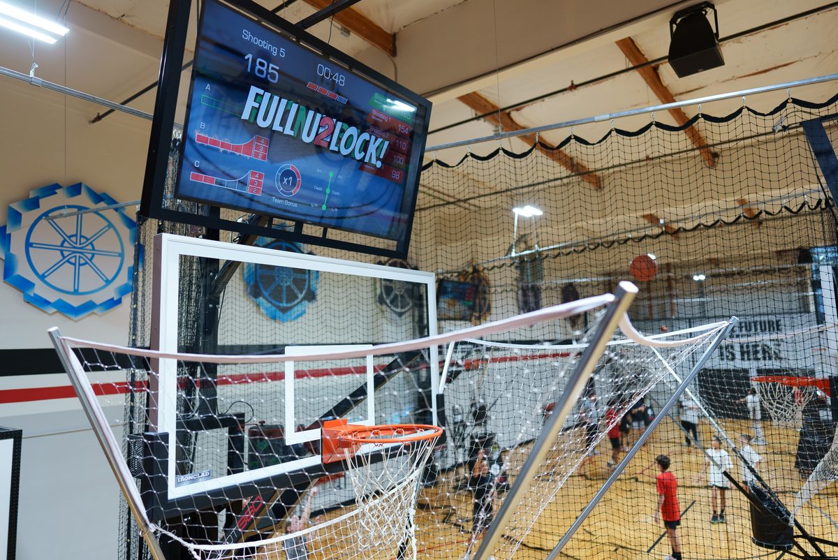 Court-side video wall displaying live training data